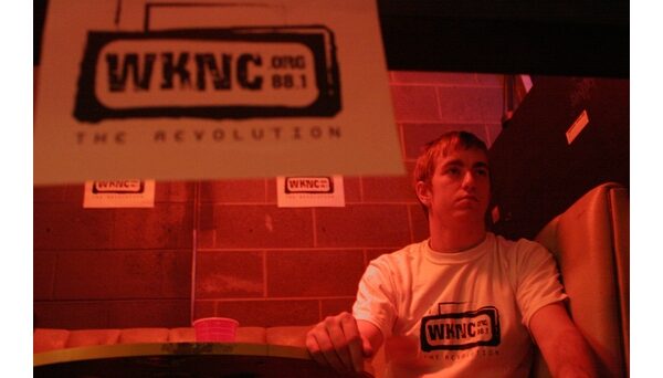 General Manager Jamie Proctor at WKNC's Double Barrel Benefit 2 on Jan. 15, 2005 at Kings Barcade. Proctor started Double Barrel Benefit as a way to supplement the station's meager budget. Photo by Melih Onvural.