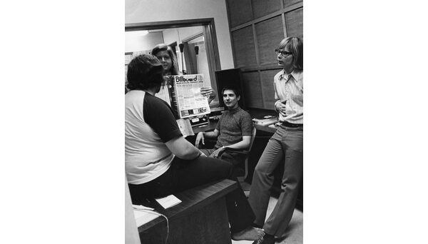 Students in the WKNC offices holding the Aug. 12, 1972 Billboard magazine. Photo from University Archives.