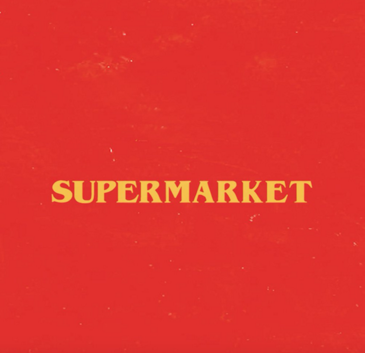 Yellow words that say "Supermarket" on a red background.
