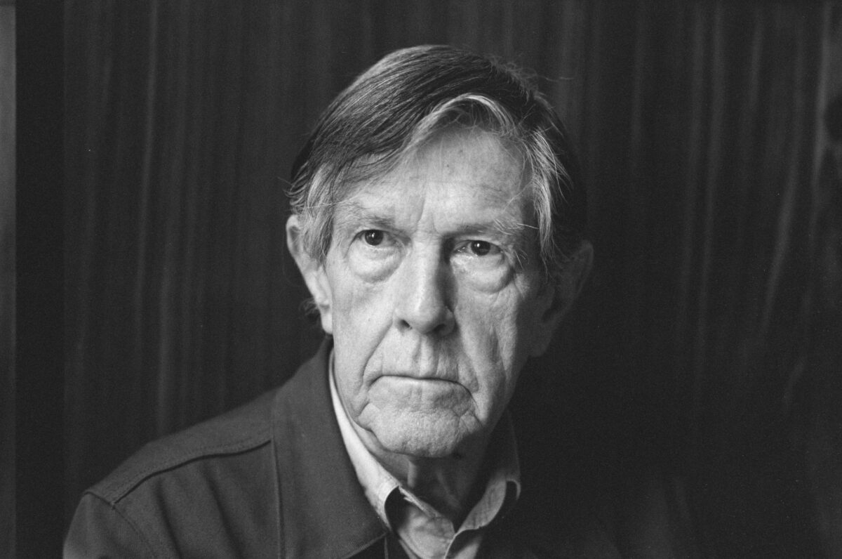 John Cage stands in an old black and white photo