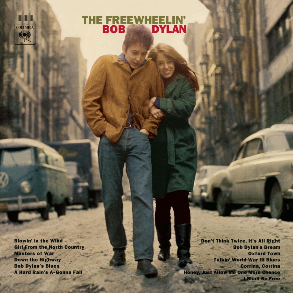 The cover of "The Free Wheelin' Bob Dylan." Pictures a man and a woman walking down the street in warm clothes, holding hands.