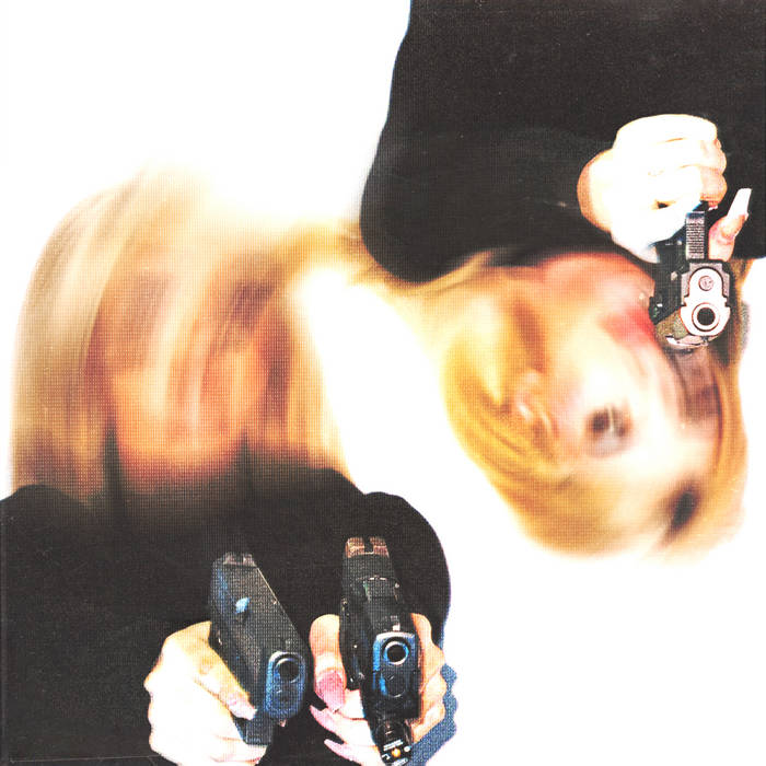 Blurred image of two blonde women pointing guns at a camera.