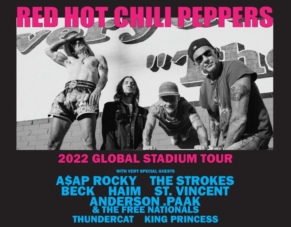 Red Hot Chili Peppers band members posing with tour announcement for 2022 Global Stadium tour featuring A$AP Rocky, The Strokes, Beck, Haim, St. Vincent, Anderson .Paak, The Free Nationals, Thundercat, and King Princess.