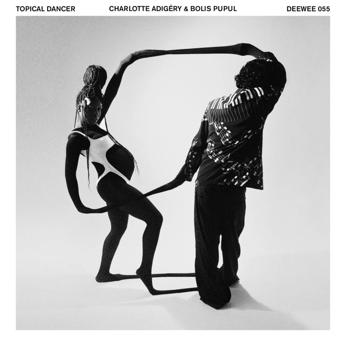 Album cover for "Topical Dancer." A black woman (left)and white man linking limbs and posed organically. Image in black and white.