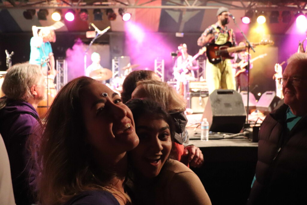 My sister and a girl posing for a picture during Kaleta and Super Yamba's stage performance.