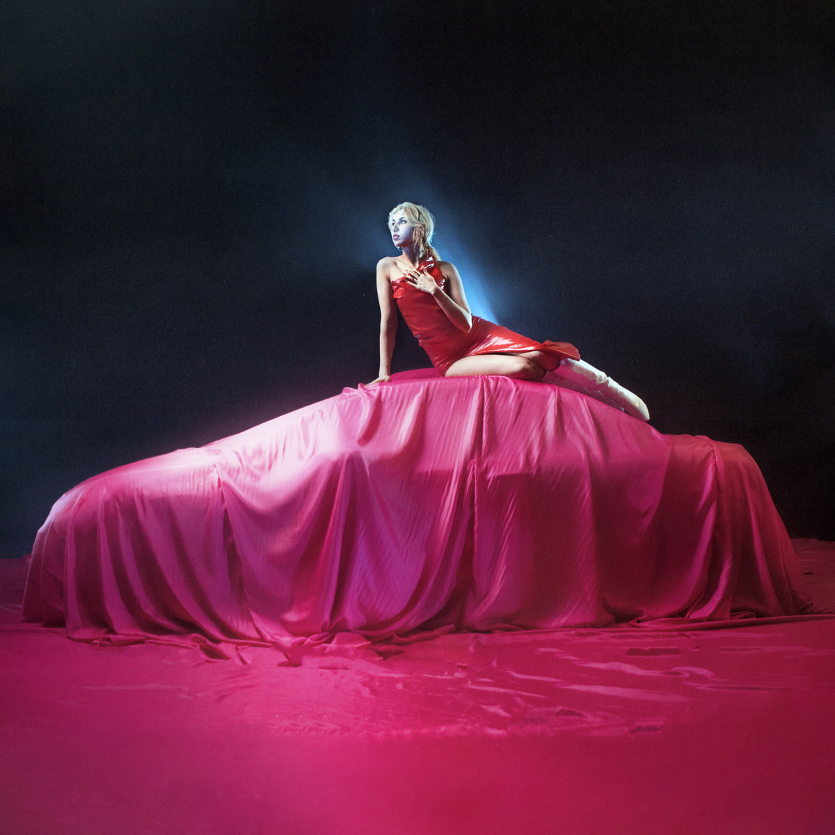 Cover art for Circulus Vitiosus by VTSS. Person elegantly sat atop a car covered in a pink sheet.