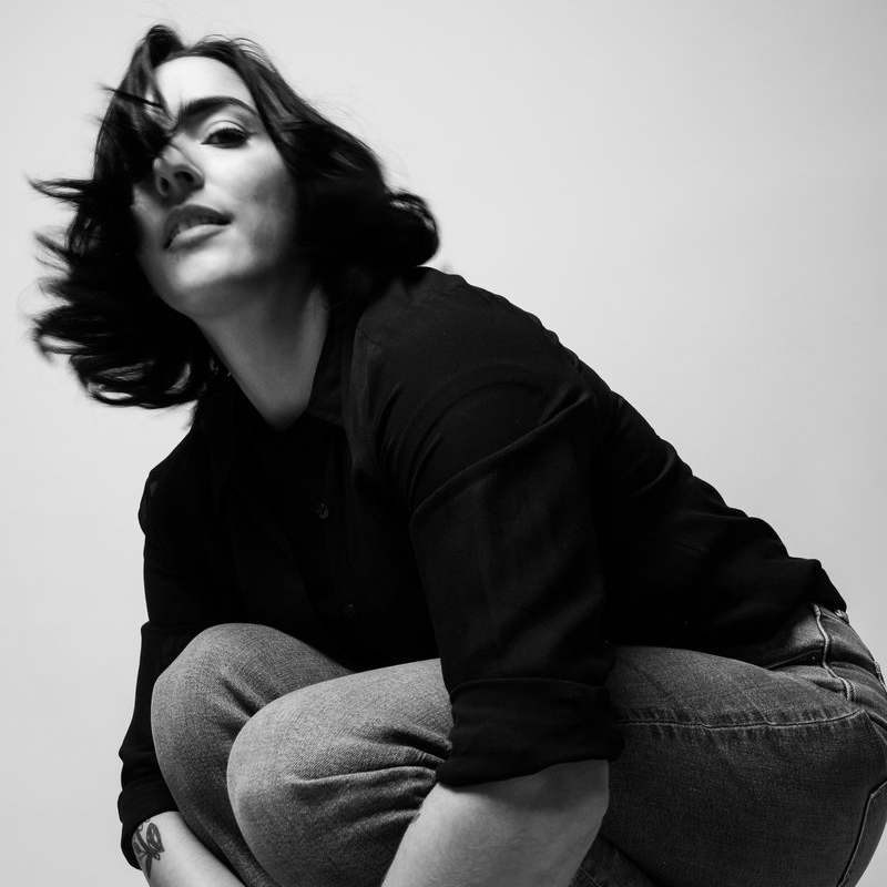 Rachel Hirsh in a black, long-sleeved T-shirt and jeans, photo by Jillian Clark