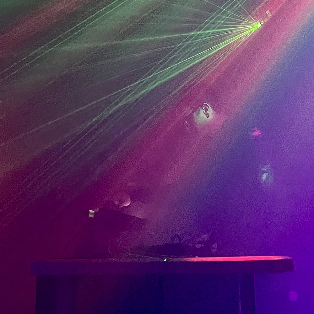mxllghxst performing, obscured by color lights