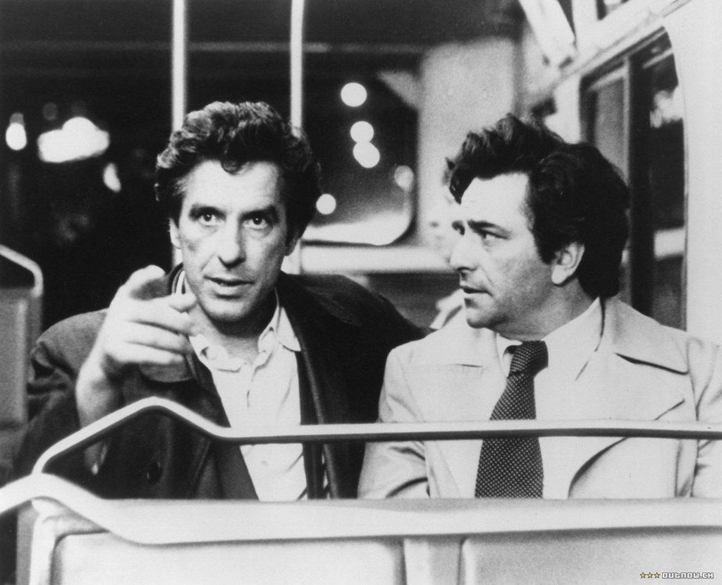 The famous Lt. Columbo (pictured on the right) in his rumpled brown trench coat alongside actor John Cassavetes. Photo by Wolf Gang is licensed under CC BY-SA 2.0.