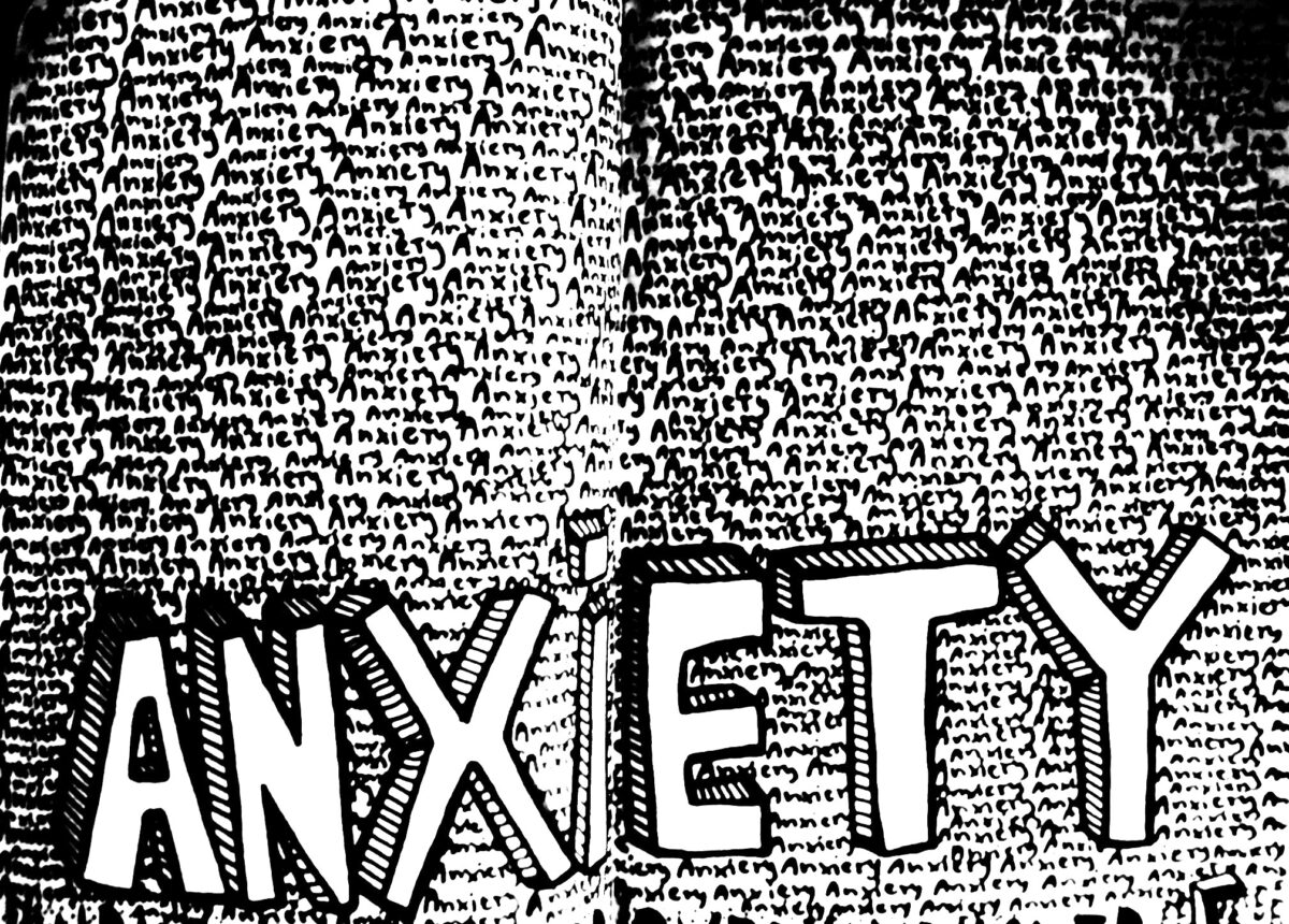 Anxiety written in small font multiple times across two pages of an open book.