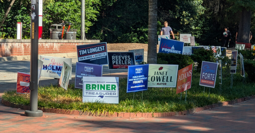 Political campaign signs outside NC State's Talley Student Union.