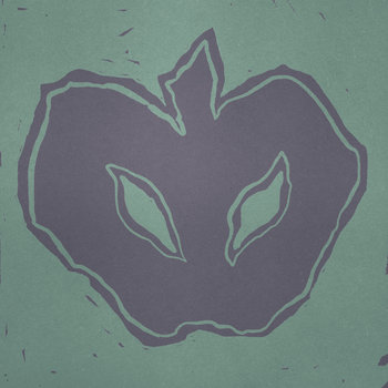 Apple with two marks on it that look like sinister eyes.
