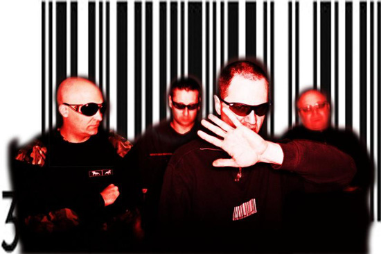 A high-contrast image of four men of the band Front 242 standing in front of a barcode pattern.