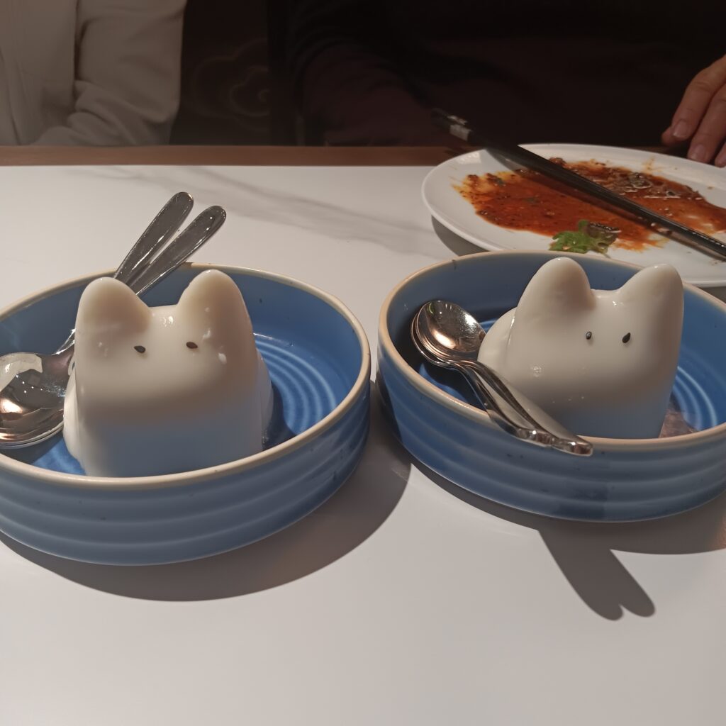 Two bowls with two white gelatin critters with pointy ears