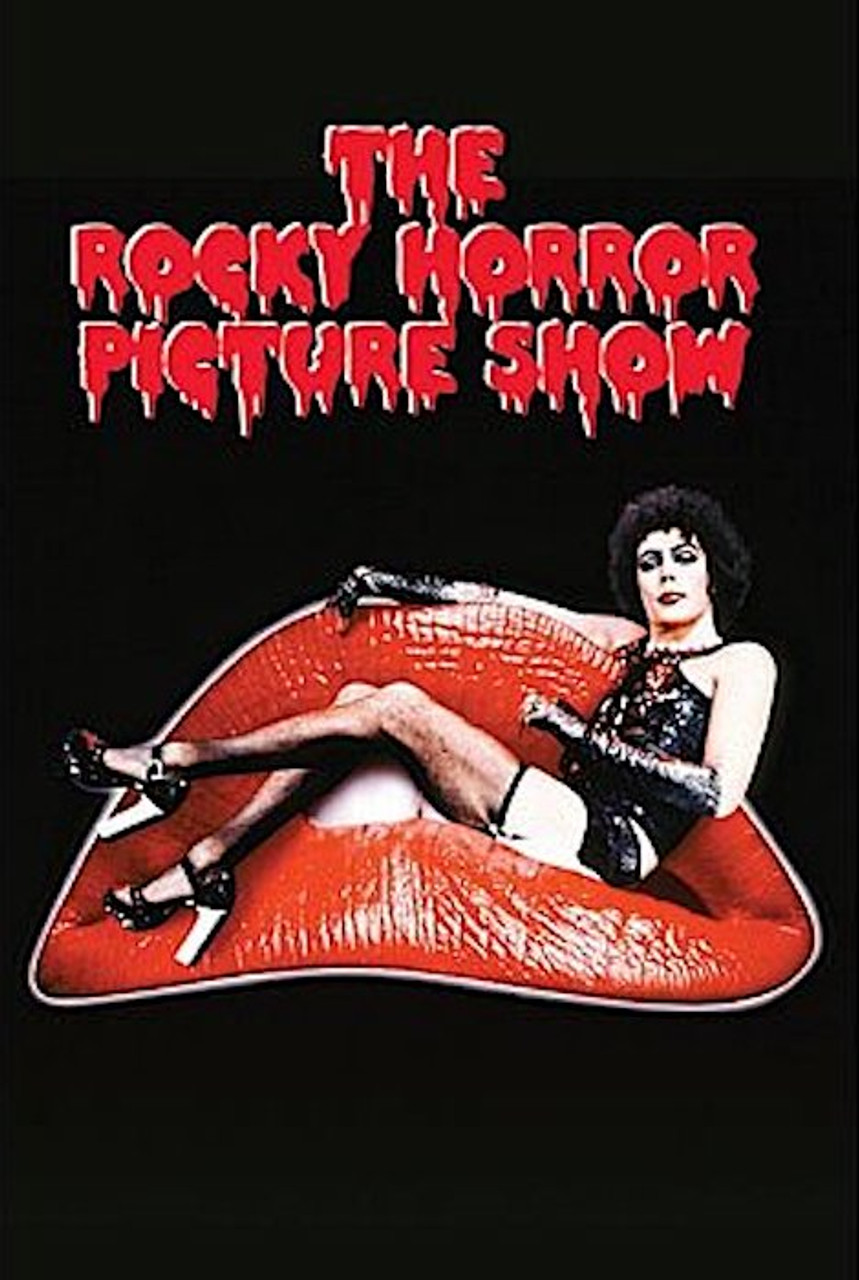 A man dressed in lingerie and heavy makeup lounging on a pair or red lips with the words "The Rocky Horror Picture Show" hovering above in red.