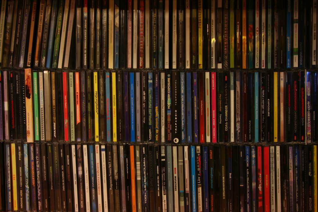 Three rows of crowded together CDs
