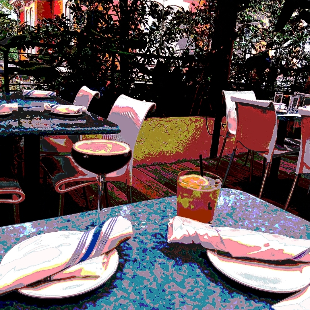 A set table at a restaurant with two drinks