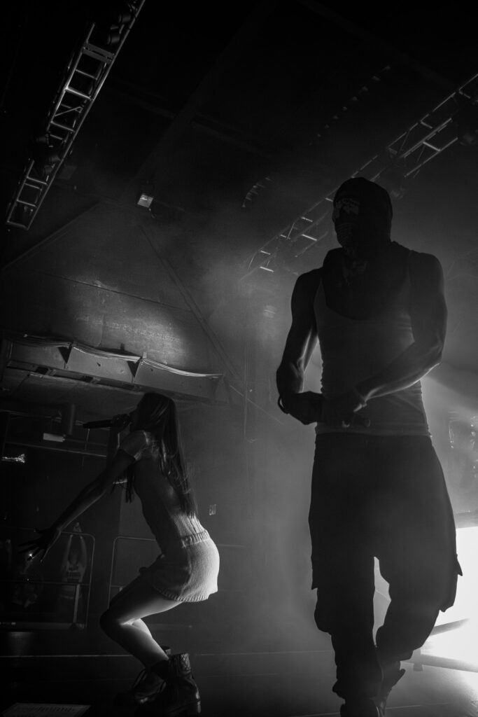 Snow Strippers at the front of the stage singing and hyping the crowd up.