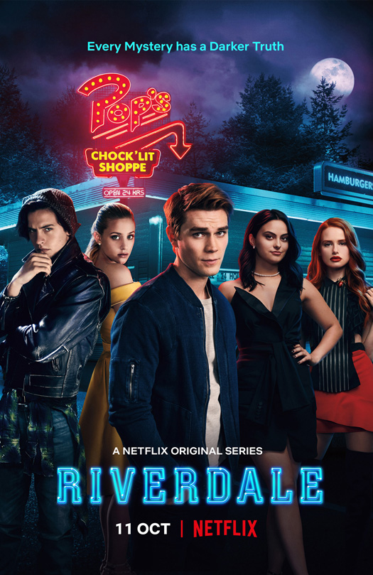 5 vaguely teenaged looking individuals standing pensively in front of an old timey diner