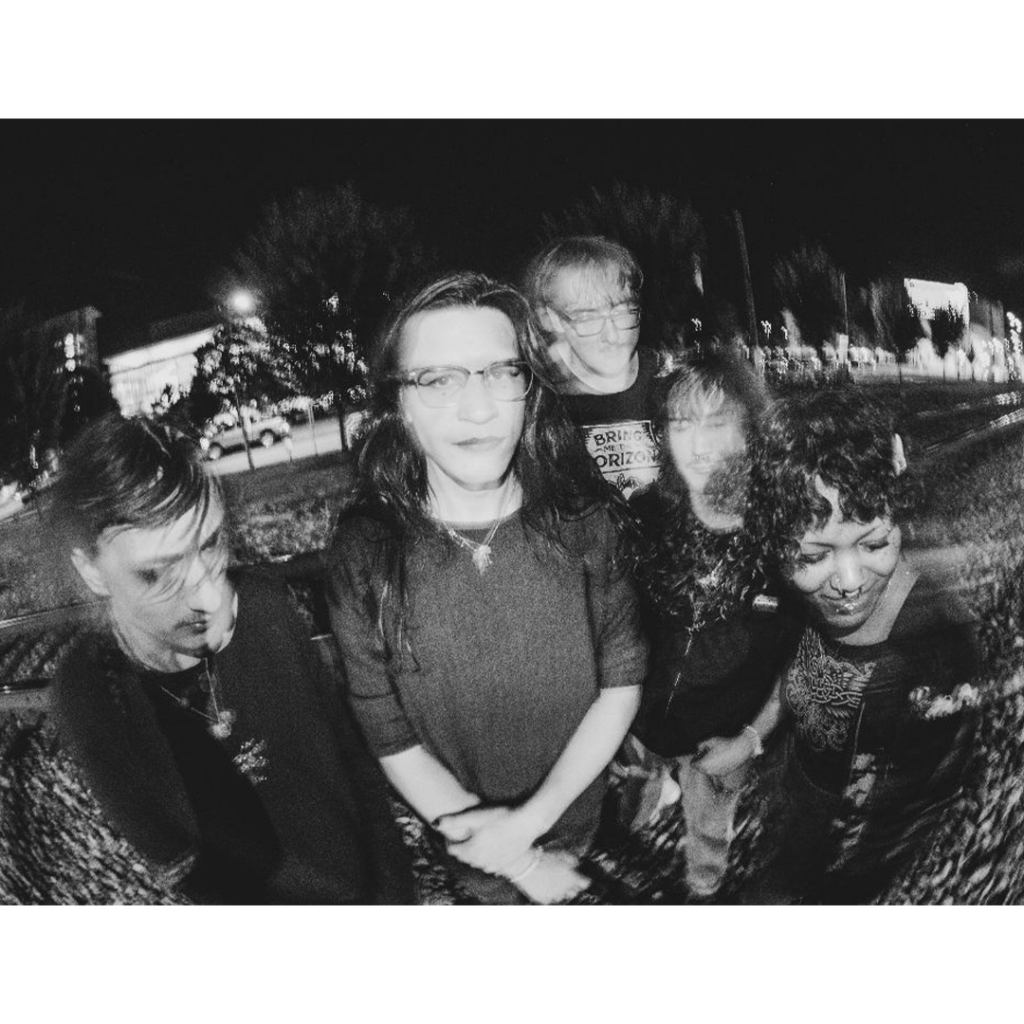 Blurry black and white photo the five members of Sunshower.