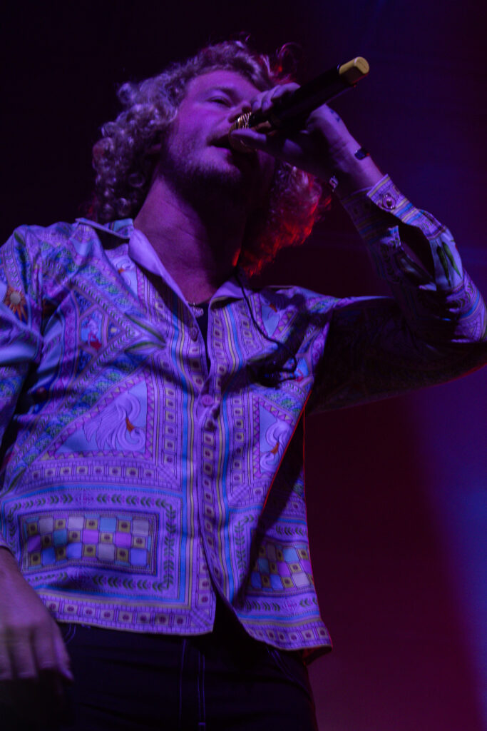 Yung Gravy with his eyes closed rapping.