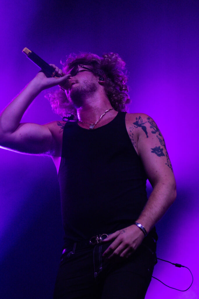 Yung Gravy with purple light surrounding him.