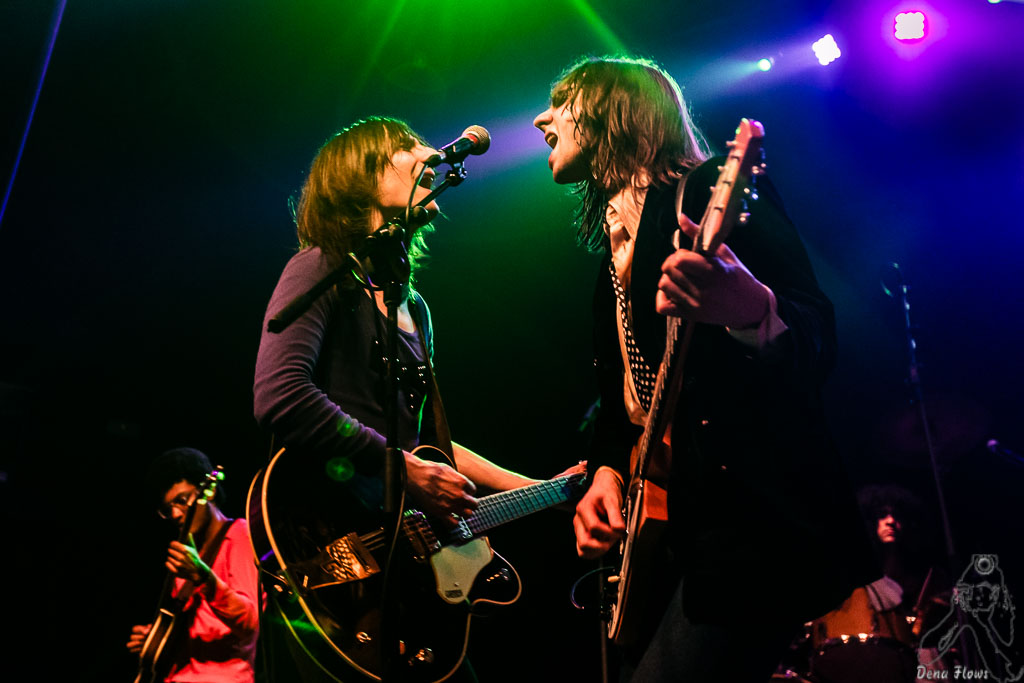 Brian and Michael D'Addario of The Lemon Twigs singing together into a microphone.