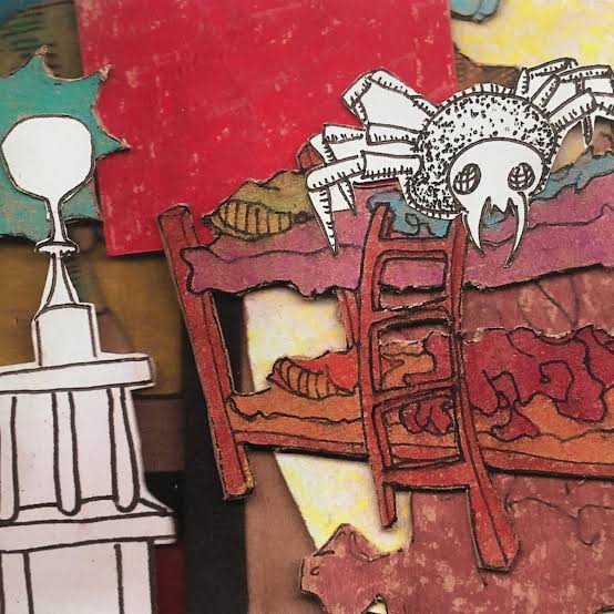 The album cover for Fancy Cookies by oh my god elephant. It seems to be a paper collage of a spider on top of a bunk bed, near some kind of lamp. It's somewhat hard to decipher.