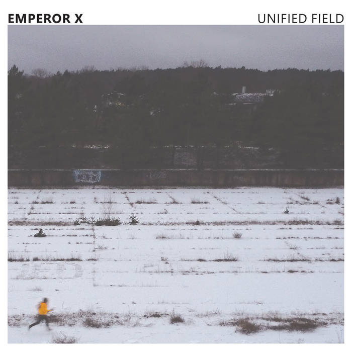 A photo of a snowy flat clime that appears to be melting somewhat. In the distance, a visage of trees is observable. Above everything else is the artist name and album title.